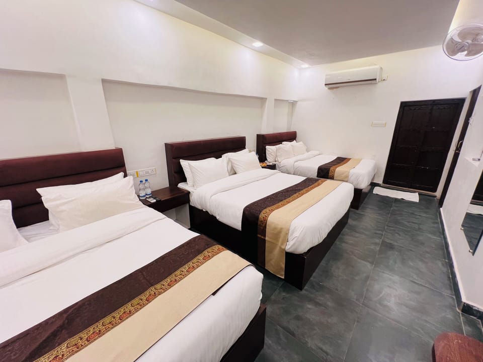 Family Suite, City View | Individually furnished, desk, laptop workspace, free WiFi