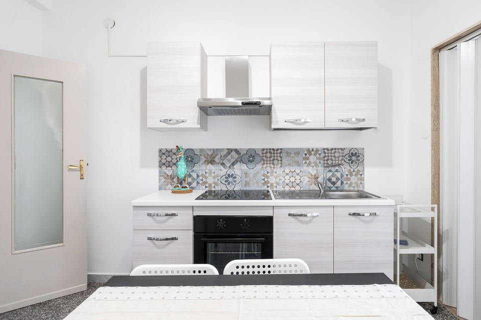 Apartment | Private kitchen | Electric kettle, dining tables