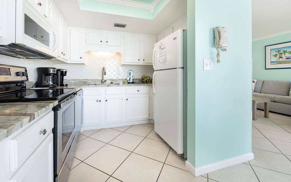Condo, 1 Bedroom | Private kitchen | Coffee/tea maker, fridge, oven, stovetop