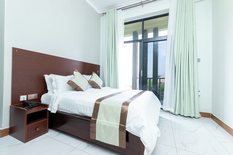 Deluxe Double Room, City View | Desk, laptop workspace, cribs/infant beds, free WiFi