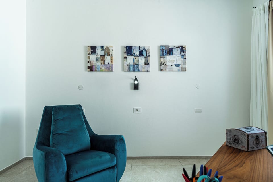 Villa, Pool View | Living area | 35-inch TV with digital channels