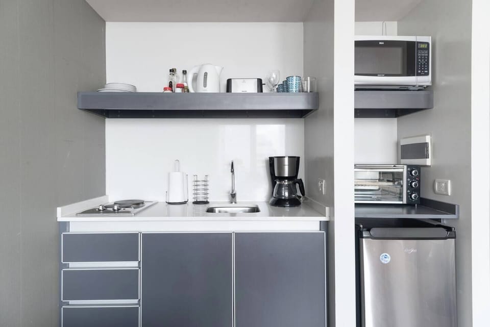Standard Studio, Balcony, City View | Private kitchen | Coffee/tea maker