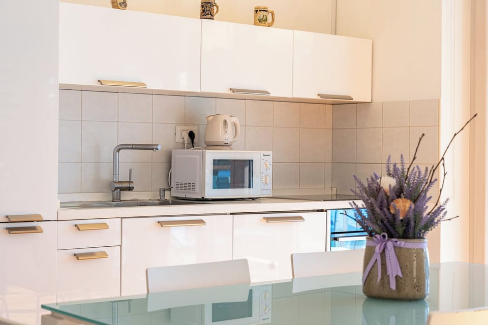 Apartment, Balcony, Sea View | Private kitchen | Electric kettle