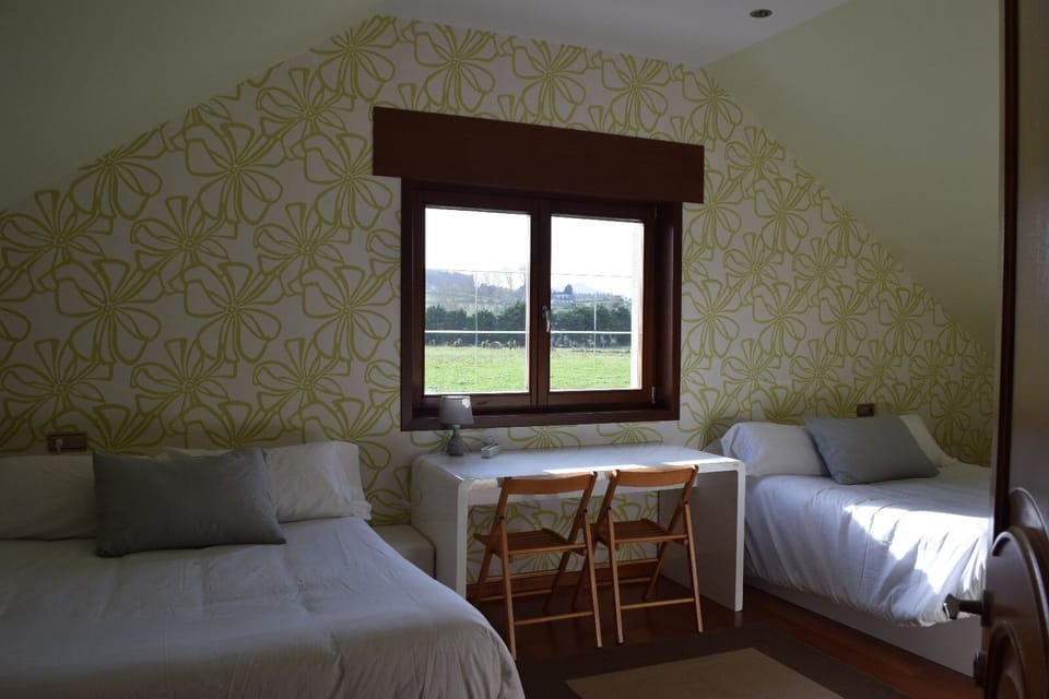 Deluxe Quadruple Room, Partial Sea View | Desk, laptop workspace, free WiFi