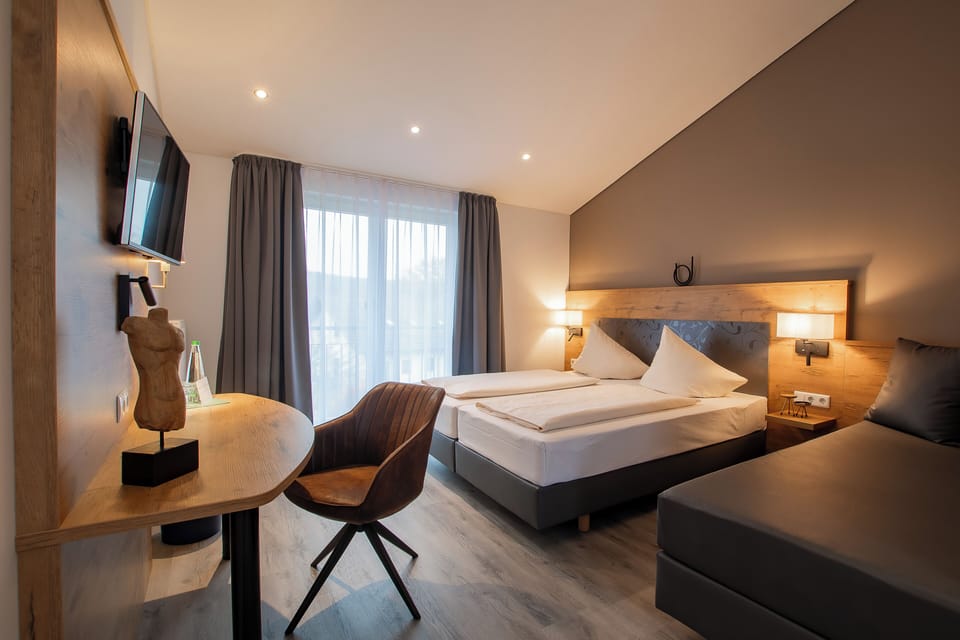 Premium bedding, desk, laptop workspace, soundproofing