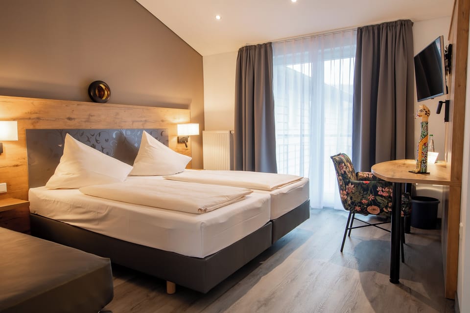 Premium bedding, desk, laptop workspace, soundproofing