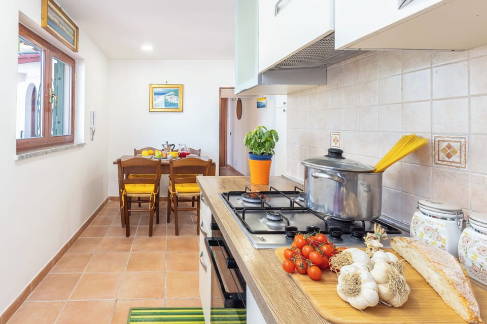 Villa | Private kitchen | Full-size fridge, oven, stovetop, dishwasher