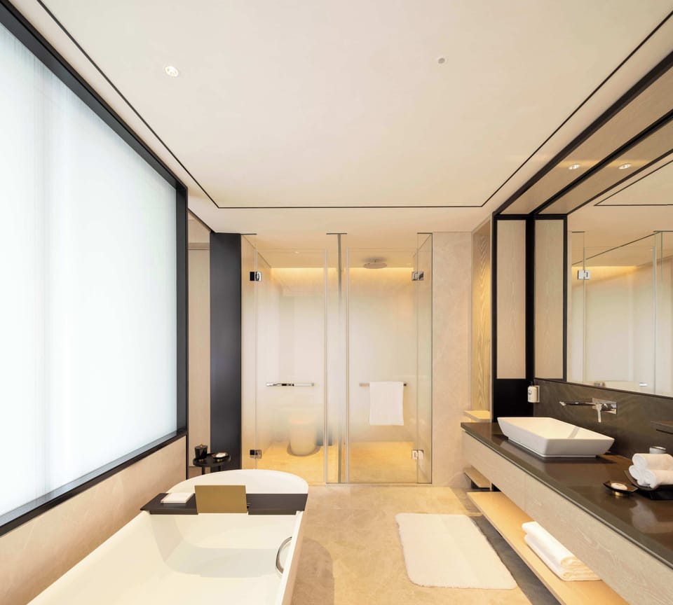 Separate tub and shower, rainfall showerhead, hair dryer, bathrobes