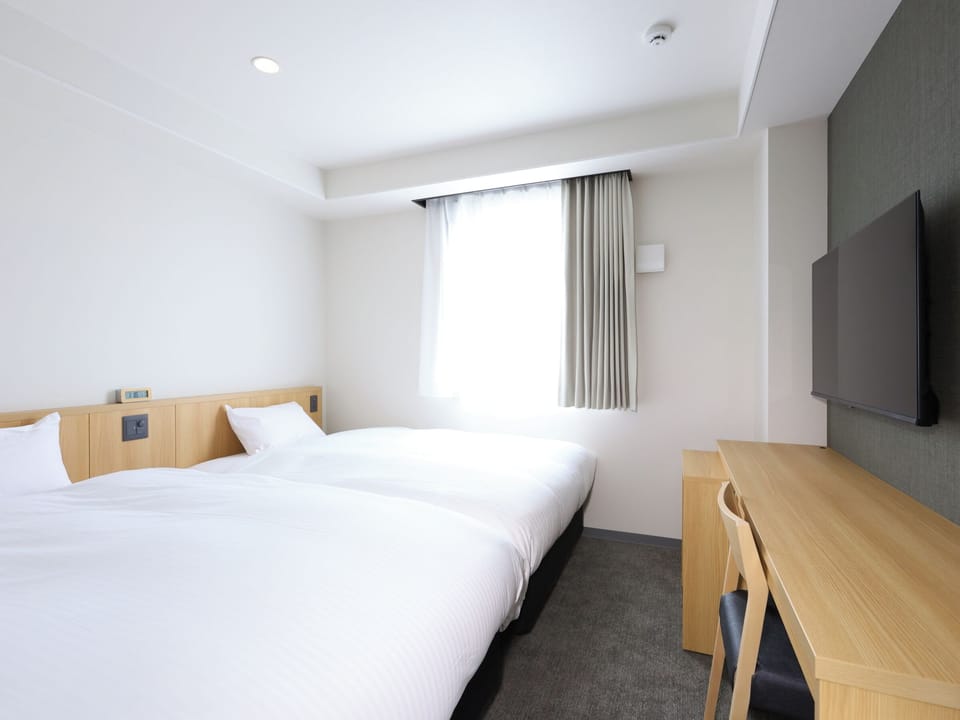Standard Twin Room, Non Smoking | Down comforters, desk, laptop workspace, free WiFi