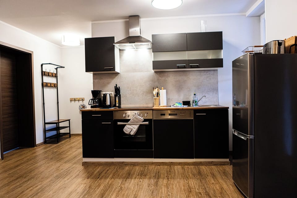 Family Apartment, Balcony, Garden View | Private kitchen | Highchair