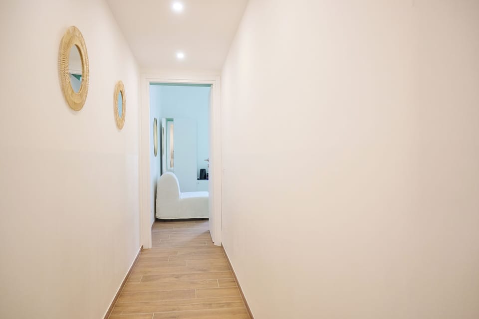 Deluxe Triple Room | Desk, laptop workspace, blackout drapes, iron/ironing board