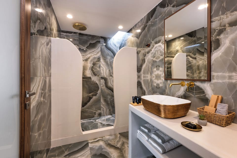 Executive Triple Room, Sea View | Bathroom | Shower, hair dryer, slippers, towels