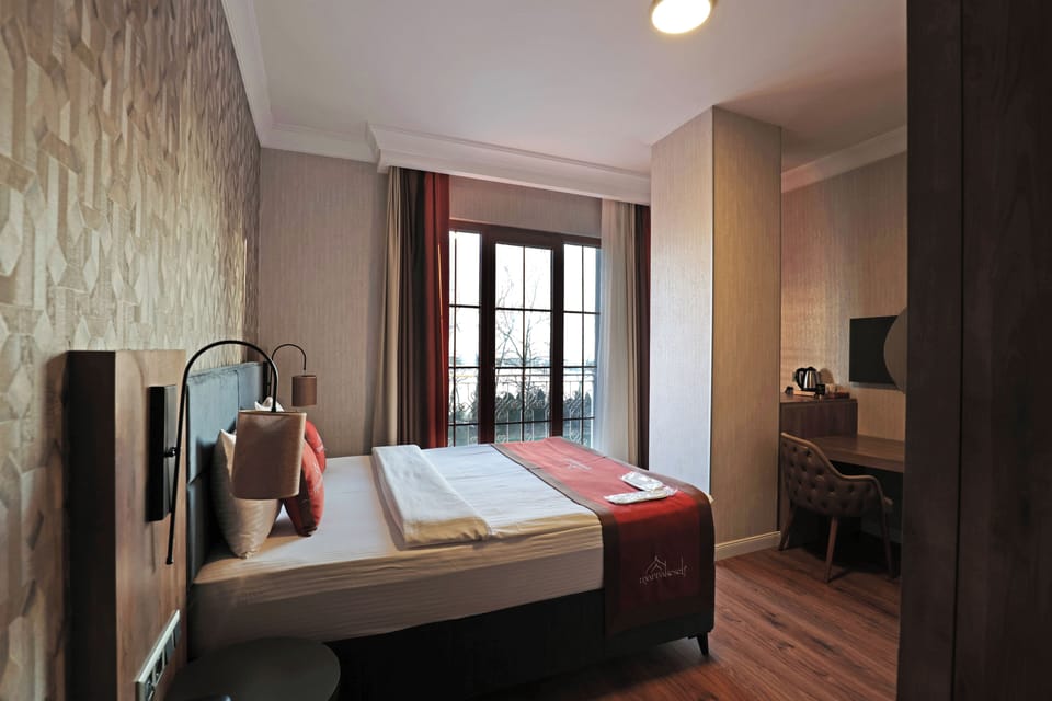 Deluxe Room, 1 Queen Bed, Sea View | Desk, laptop workspace, free WiFi