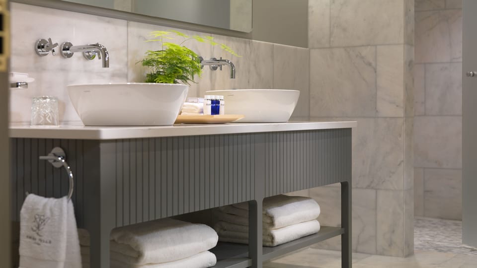 Combined shower/tub, designer toiletries, hair dryer, bathrobes