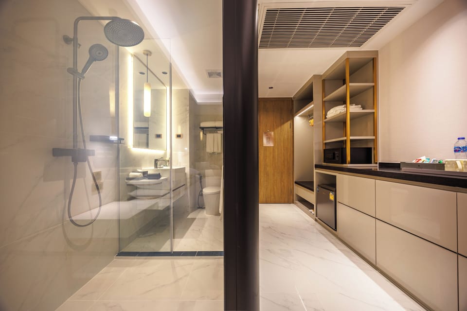 Deluxe Double Room, Balcony, City View | Bathroom | Shower, hair dryer, bathrobes, slippers