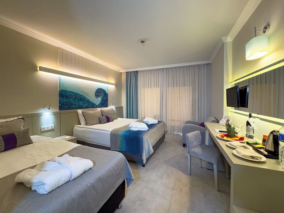 Standard Room (Sea or Mountain View) | Minibar (free items), in-room safe, desk, blackout drapes