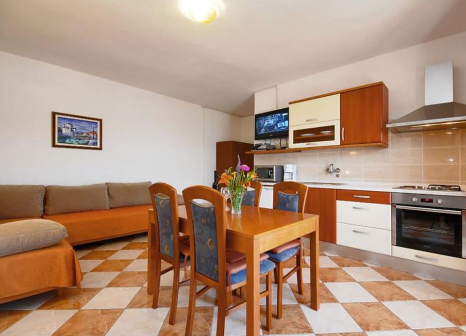 Apartment (One Bedroom Apartment with Balcony an) | Living room | 32-inch flat-screen TV with cable channels
