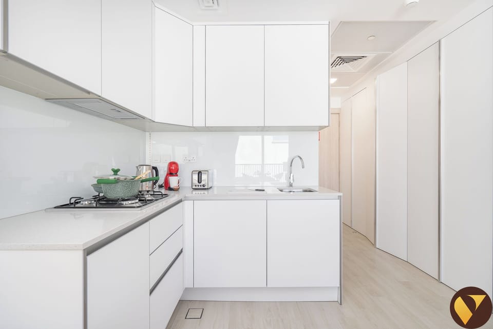 Luxury Studio, City View | Private kitchen | Full-size fridge, microwave, oven, stovetop