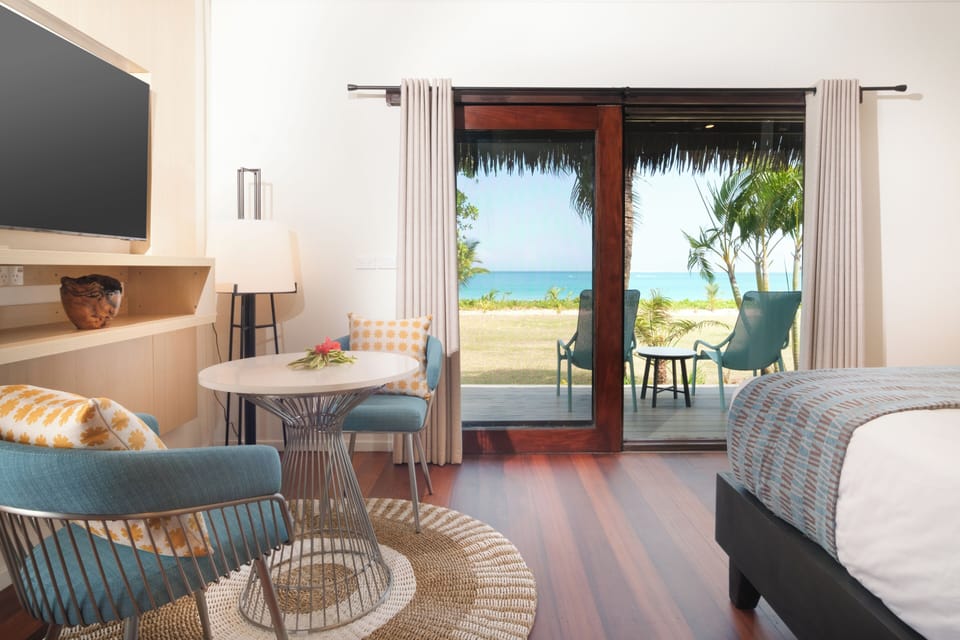 Deluxe Beachfront Bure | Premium bedding, in-room safe, desk, laptop workspace
