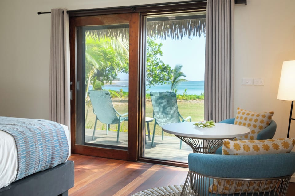 Deluxe Beachfront Bure | Premium bedding, in-room safe, desk, laptop workspace