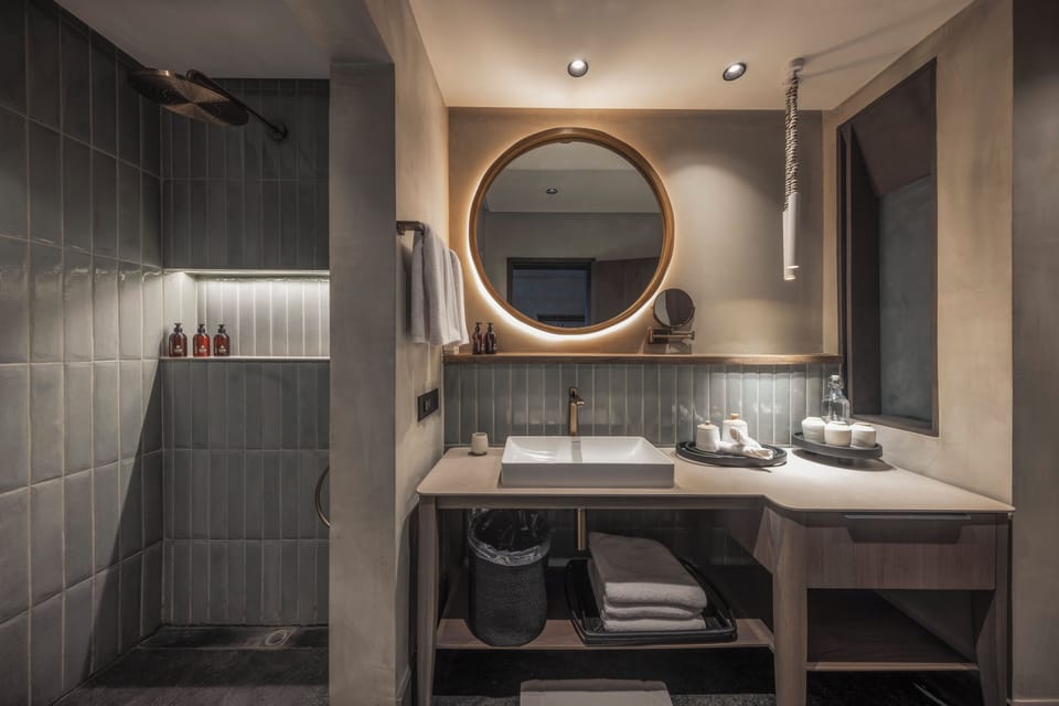 Separate tub and shower, hair dryer, bathrobes, slippers