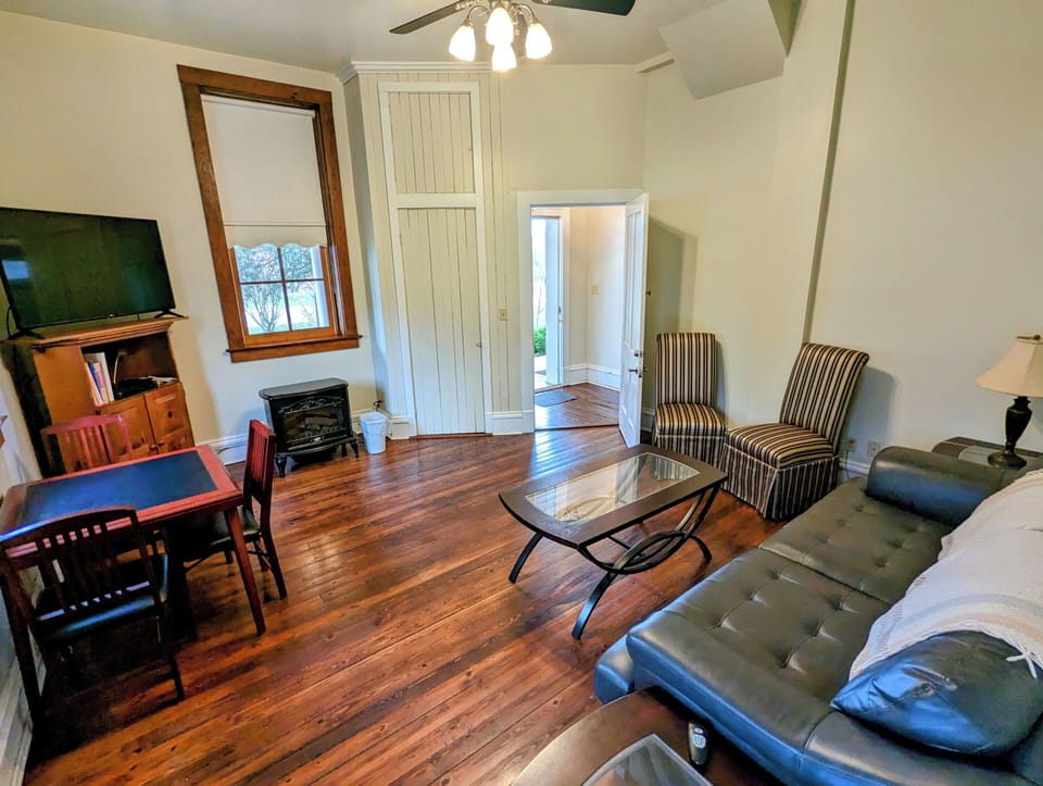 Deluxe Suite, Patio | Living area | TV