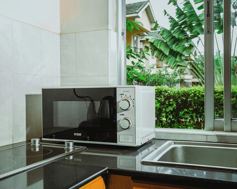 Mini-fridge, microwave, stovetop, cookware/dishes/utensils