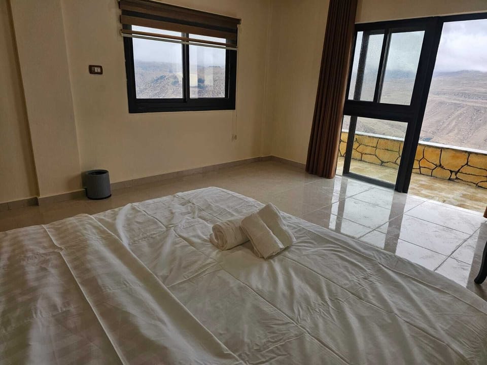 Deluxe Cottage, Balcony | In-room safe, desk, laptop workspace, blackout drapes