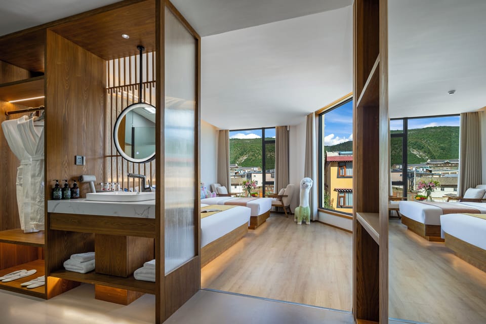 Family Triple Room, City View | Bathroom | Rainfall showerhead, eco-friendly toiletries, hair dryer, bathrobes