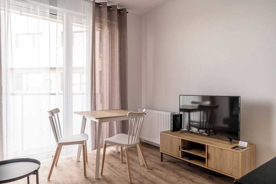 Studio Suite, Balcony | Living area | TV