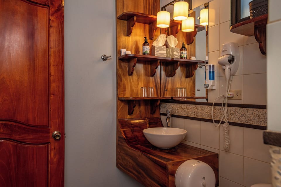 Deluxe Double Room, Balcony, Partial Sea View | Bathroom | Shower, hair dryer, towels, soap