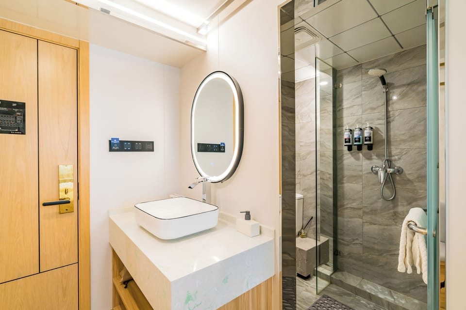 Shower, free toiletries, hair dryer, slippers