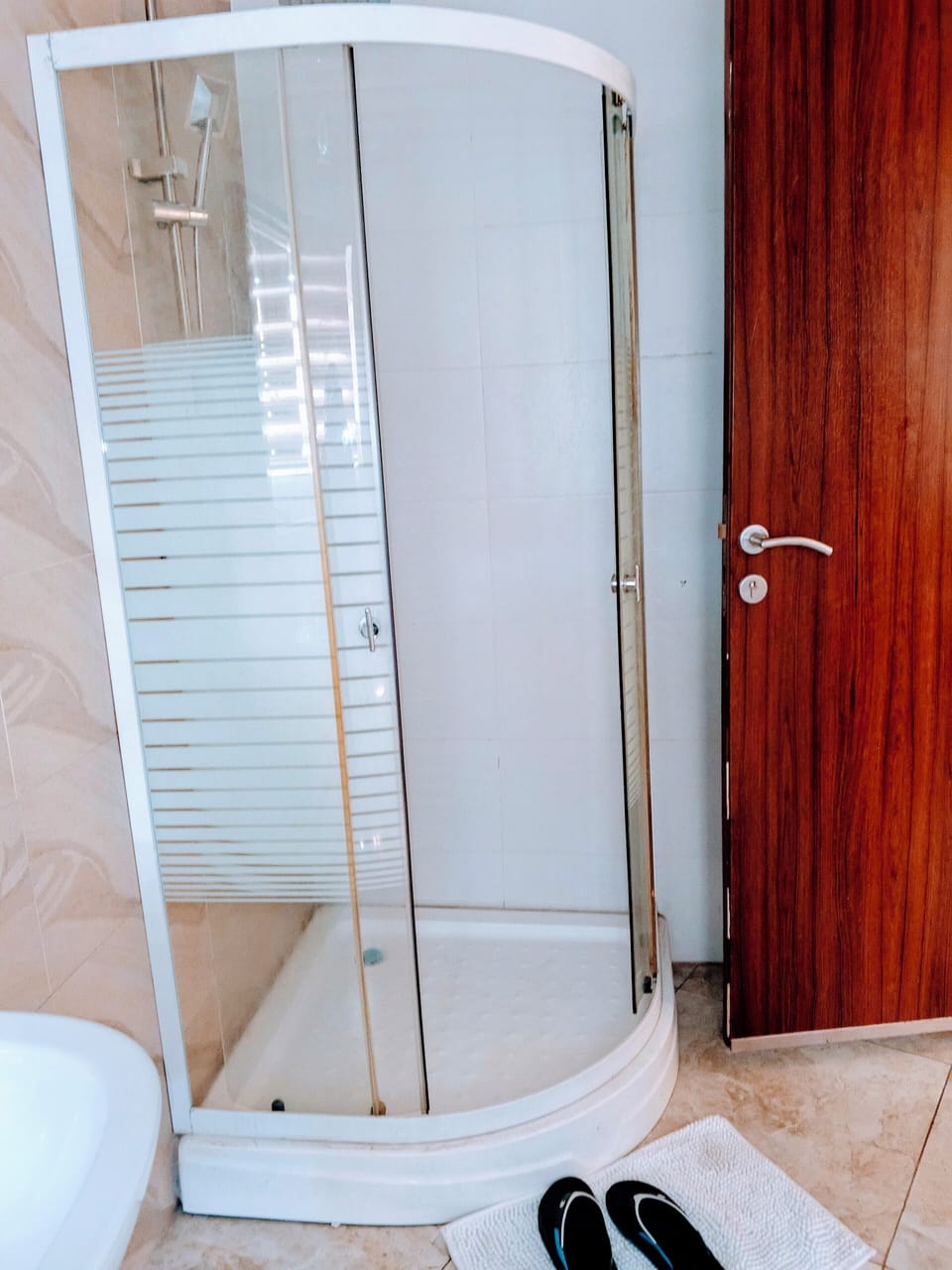Shower, bathrobes, slippers, towels