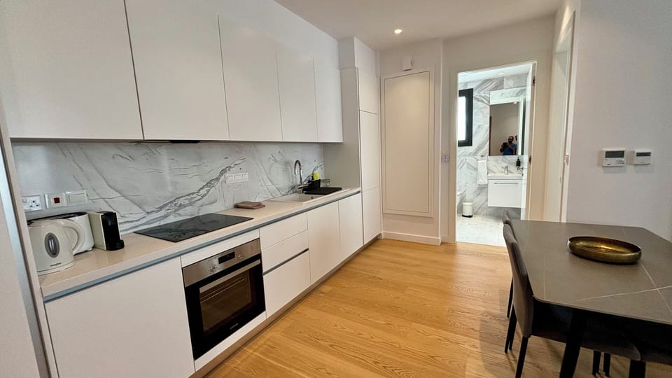Deluxe Apartment, City View | Private kitchen | Microwave, oven, stovetop, highchair