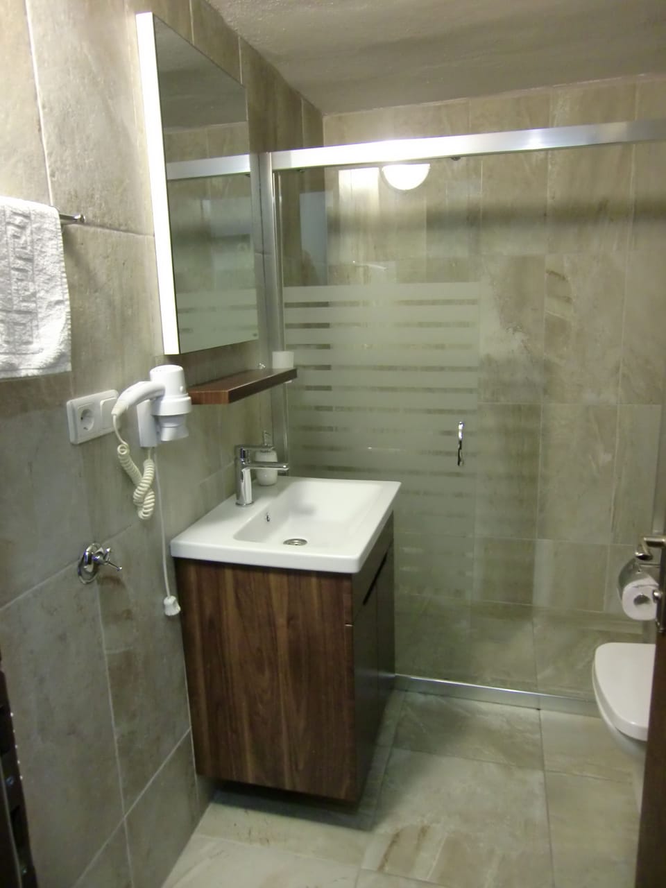Shower, free toiletries, hair dryer, slippers