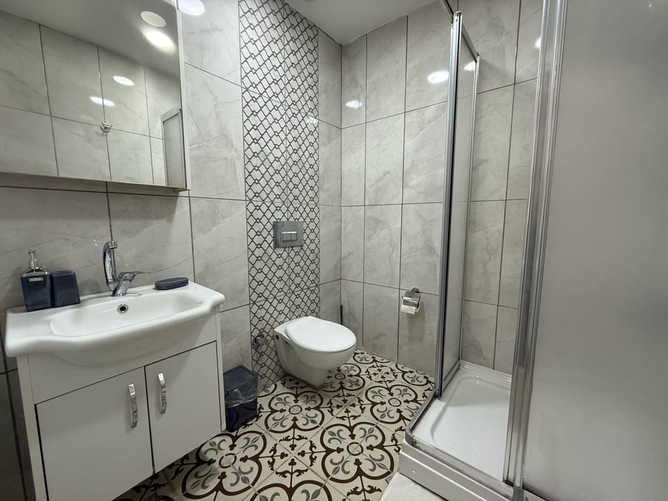 Deluxe Double Room, City View | Bathroom | Shower, hair dryer, slippers, towels