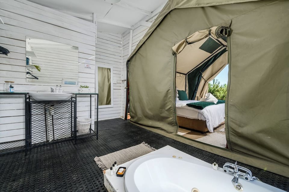 Luxury Tent, Mountain View | Bathroom | Combined shower/tub, jetted tub, rainfall showerhead, free toiletries