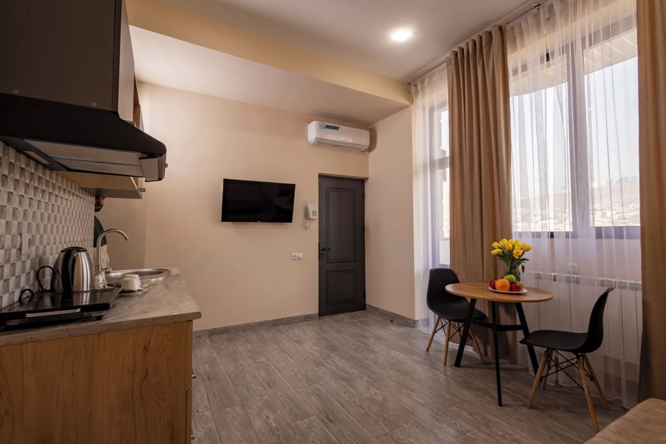 Studio, Balcony, City View | Living area | 40-inch Smart TV with digital channels