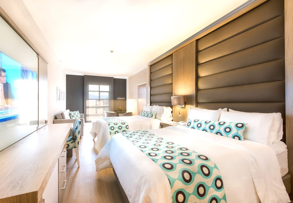 Standard Twin Room | Minibar, in-room safe, desk, blackout drapes