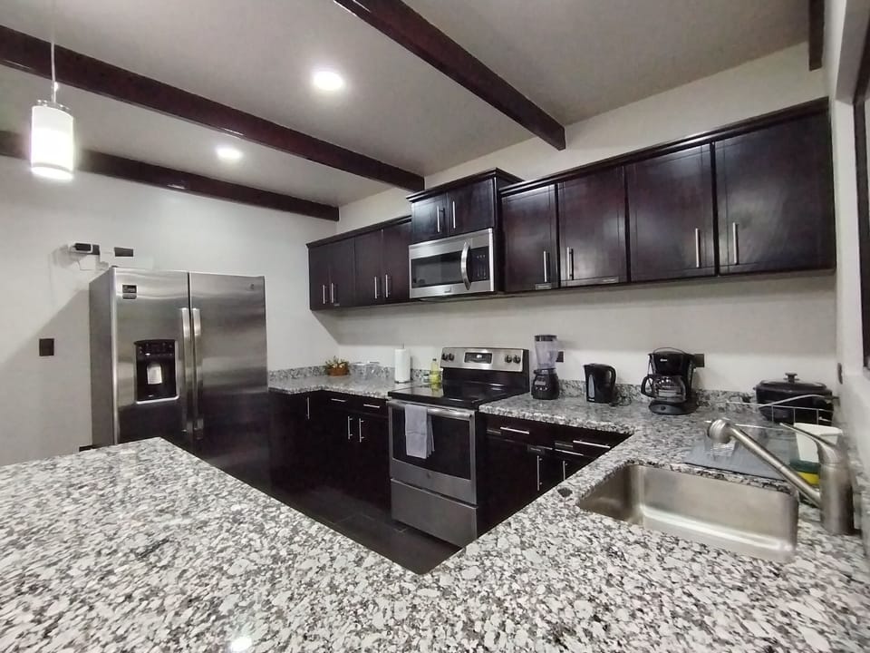 Comfort Villa | Private kitchen | Fridge, microwave, stovetop, cookware/dishes/utensils