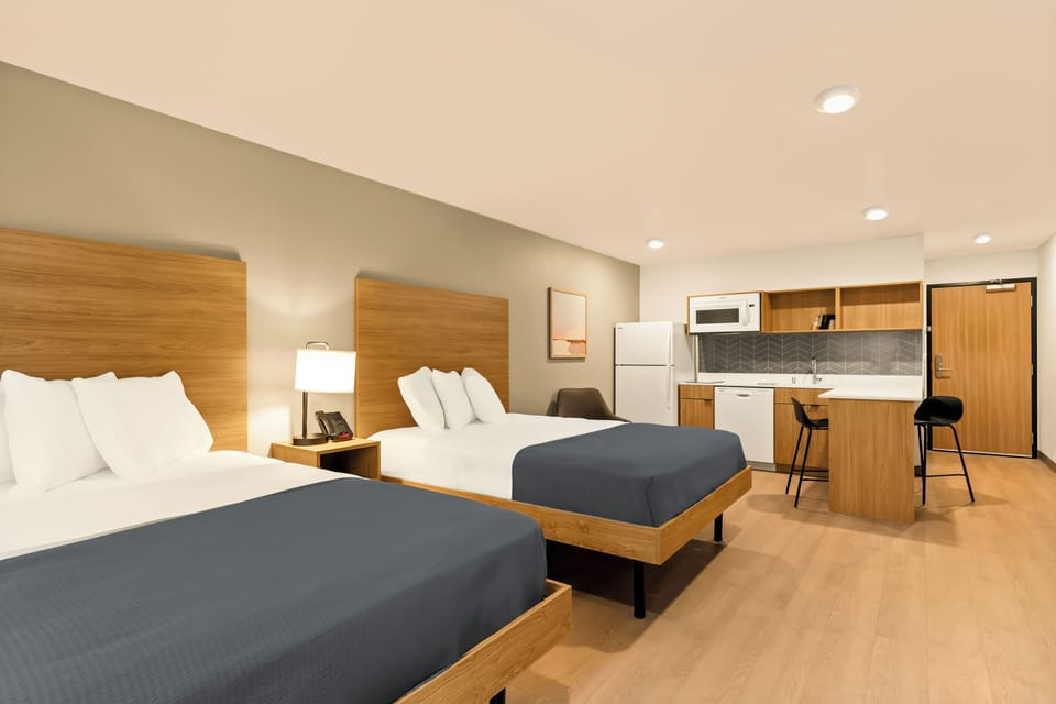 Suite, 2 Queen Beds, Non Smoking | 1 bedroom, laptop workspace, free WiFi, bed sheets