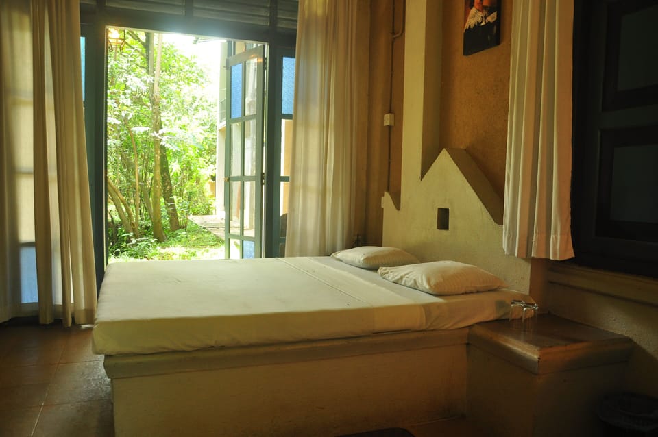 Economy Double Room, Balcony, Garden View | In-room safe, blackout drapes, free WiFi
