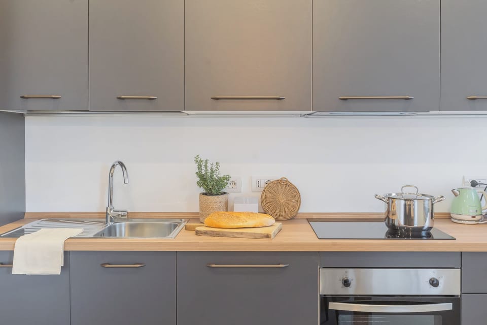 Apartment (1 Bedroom) | Private kitchen | Oven, espresso maker, electric kettle, highchair