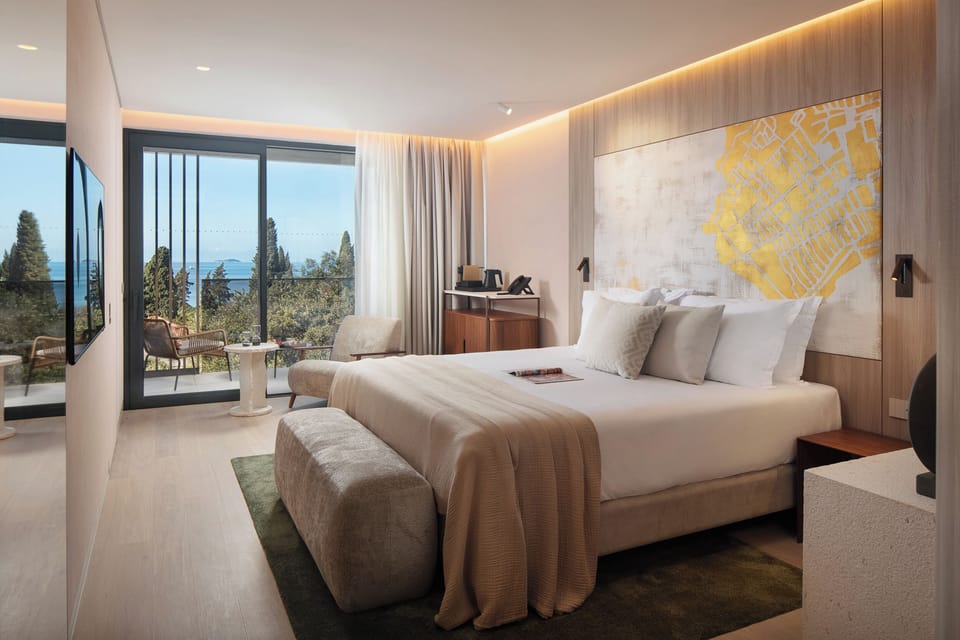 Deluxe Double or Twin Room | Minibar, in-room safe, desk, blackout drapes