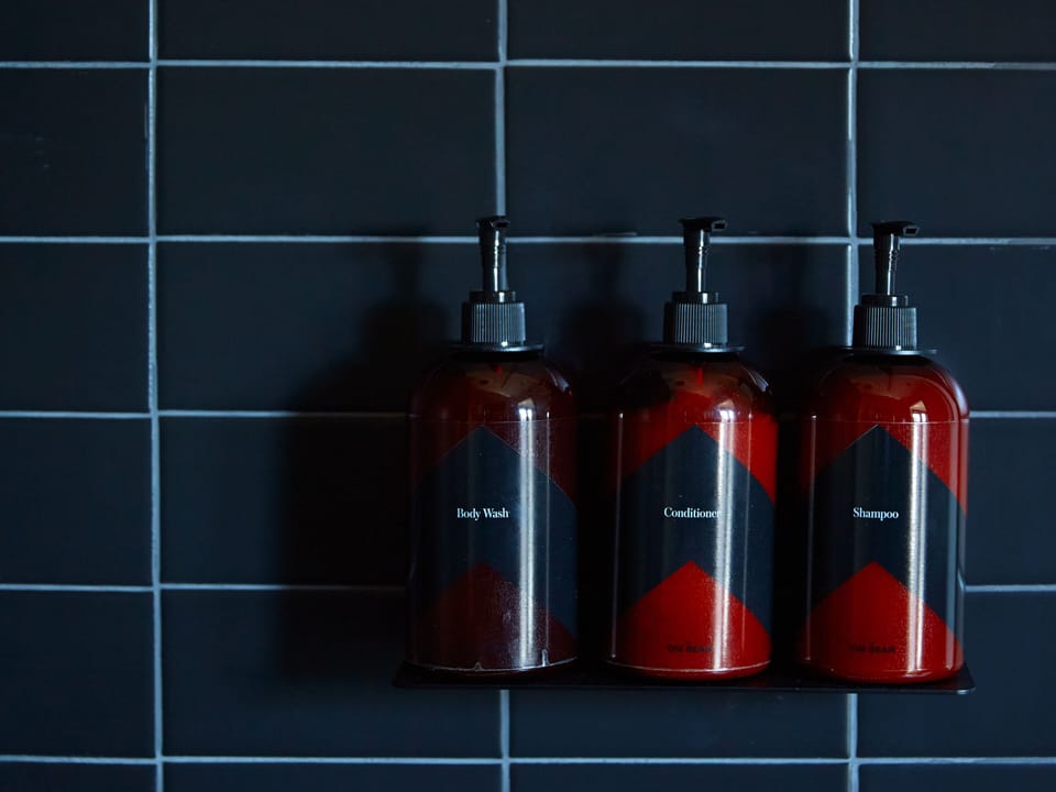 Shower, designer toiletries, hair dryer, towels