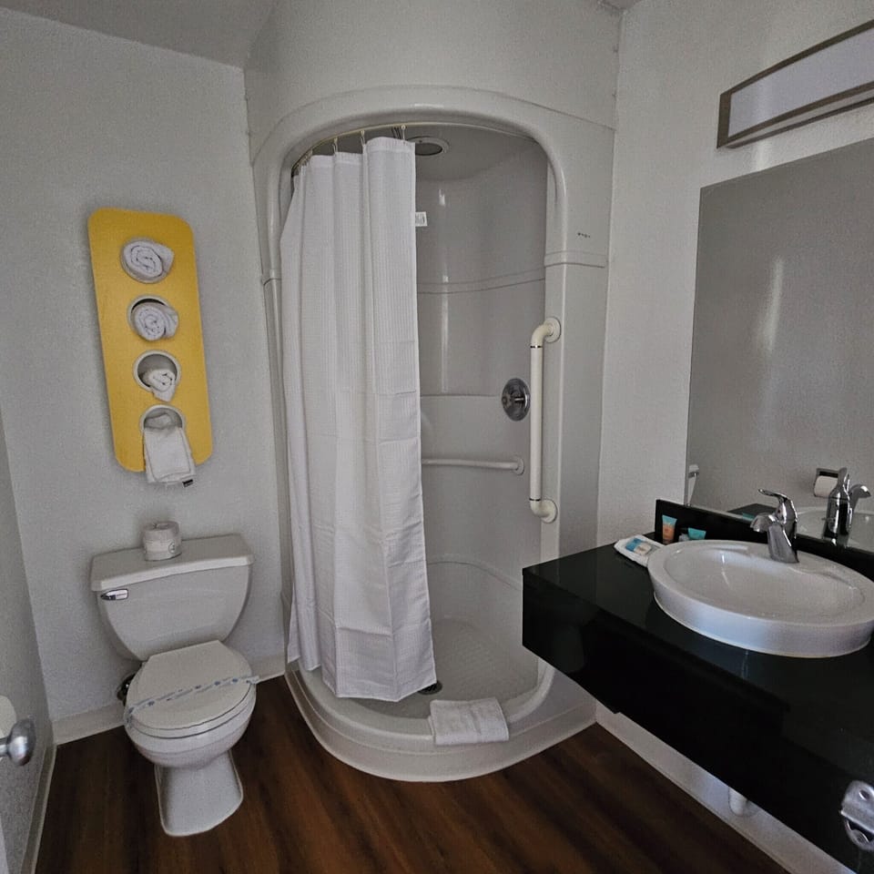 Standard Studio Suite | Bathroom | Shower, towels, soap, shampoo