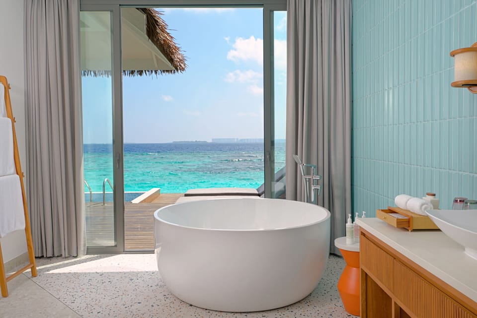 Villa, 1 King Bed, Overwater (Pool) | Bathroom | Separate tub and shower, rainfall showerhead, designer toiletries