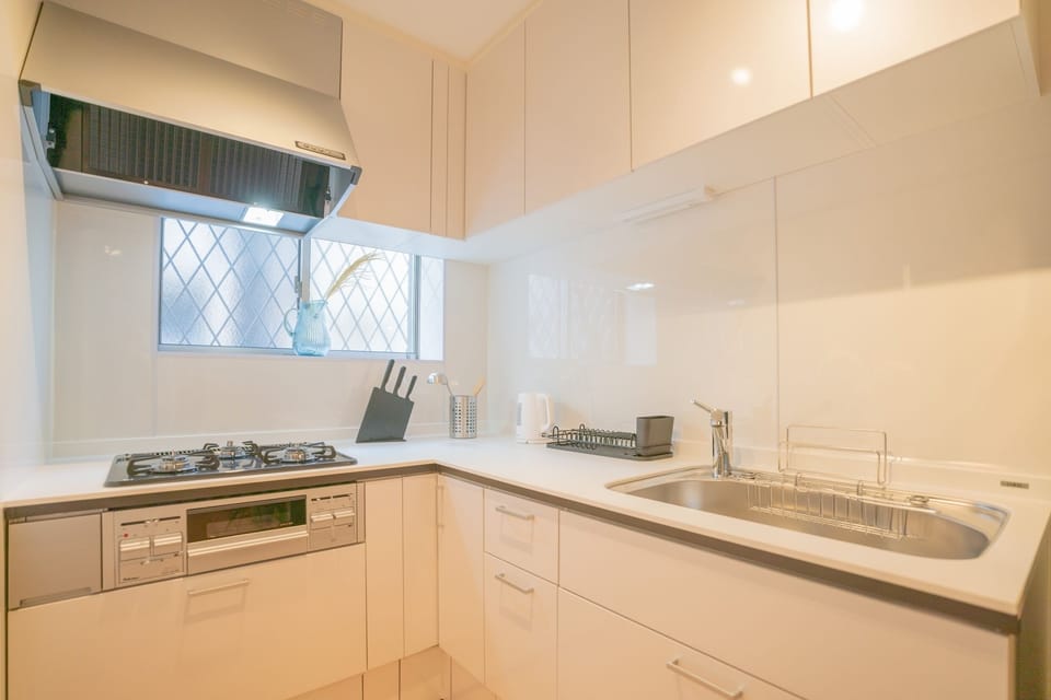 Comfort Villa | Private kitchen | Dishwasher, electric kettle, cleaning supplies, paper towels
