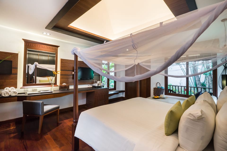 Premier Deluxe Villa | Minibar, in-room safe, desk, blackout drapes