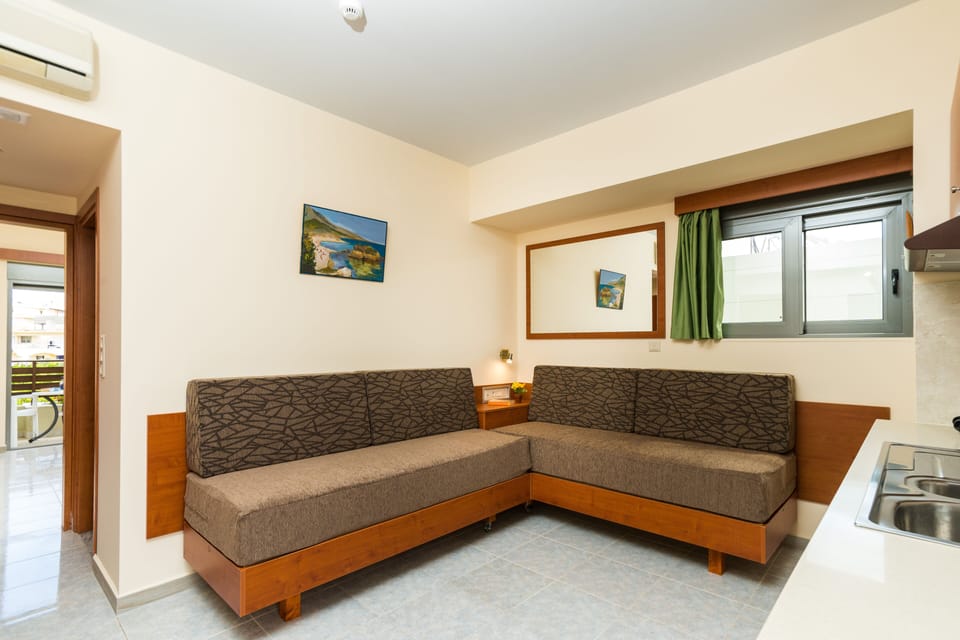 Superior Apartment | Living area | 32-inch Smart TV with satellite channels